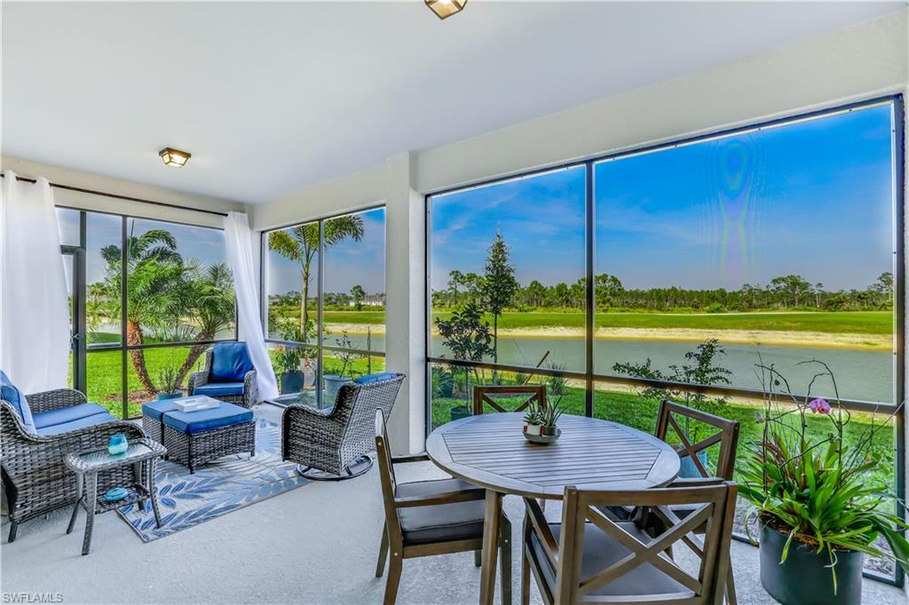 a view of a dining room with furniture window and outside view