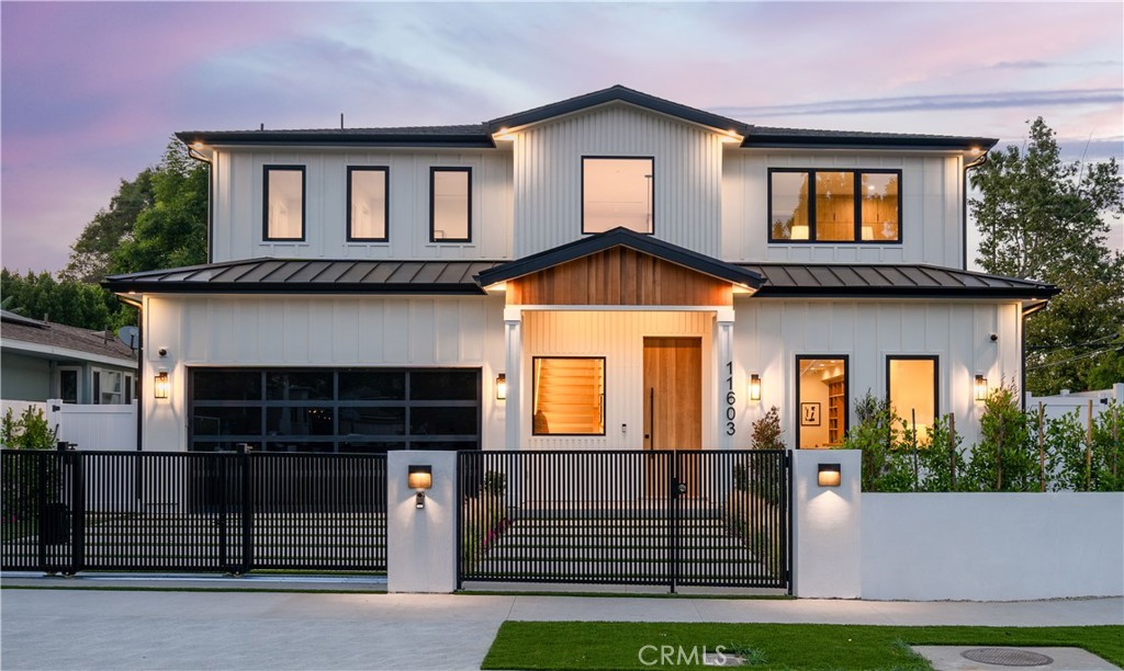 a front view of a house with garage