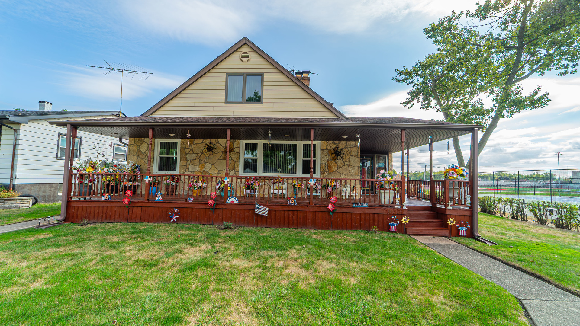 a view of a house with a backyard porch and sitting area