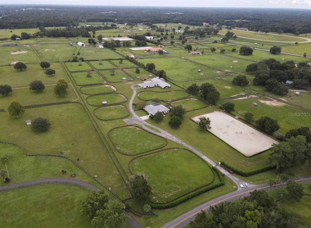 an aerial view of a residential houses with outdoor space