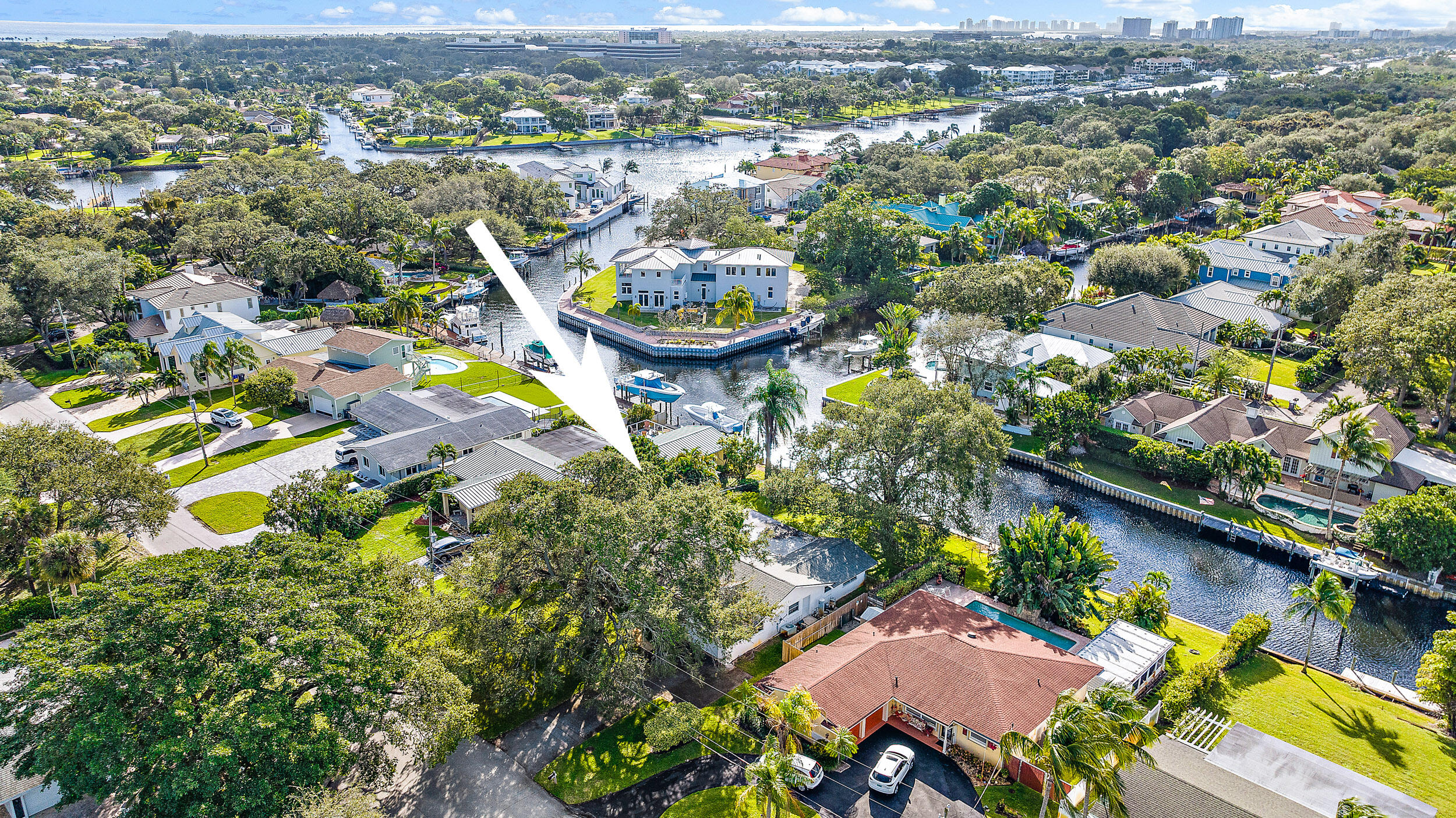 an aerial view of a house with a lake view