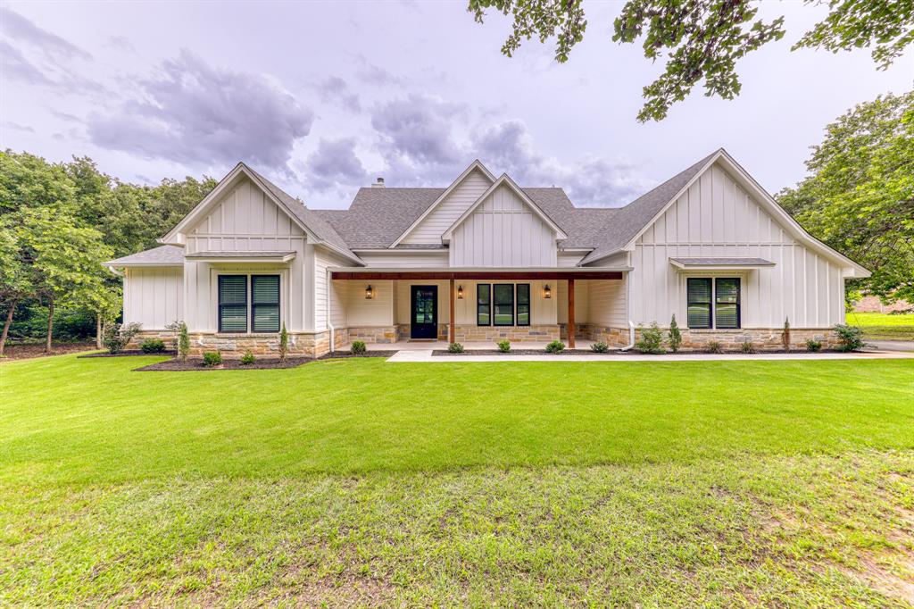 a front view of house with yard and seating area