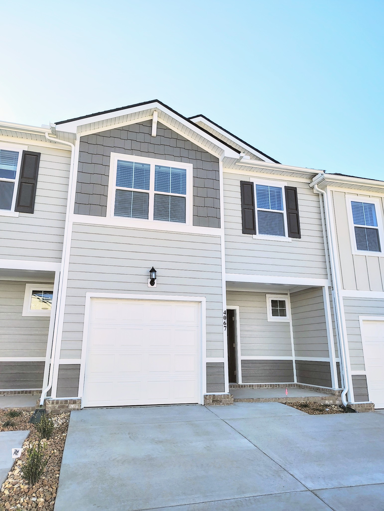 a front view of a house with a garage