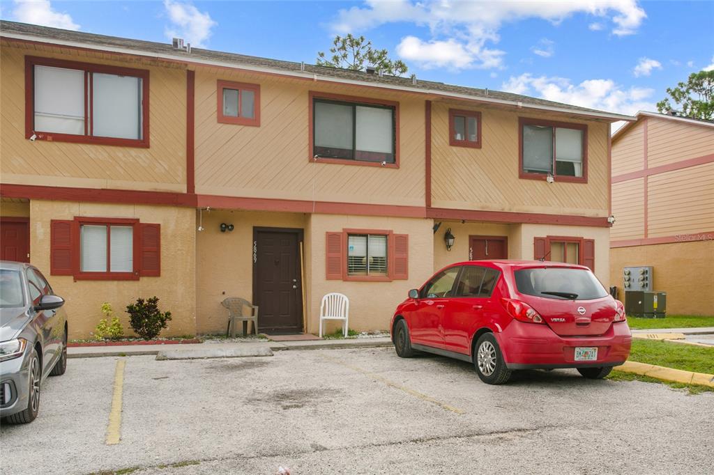 a front view of a house with parking space