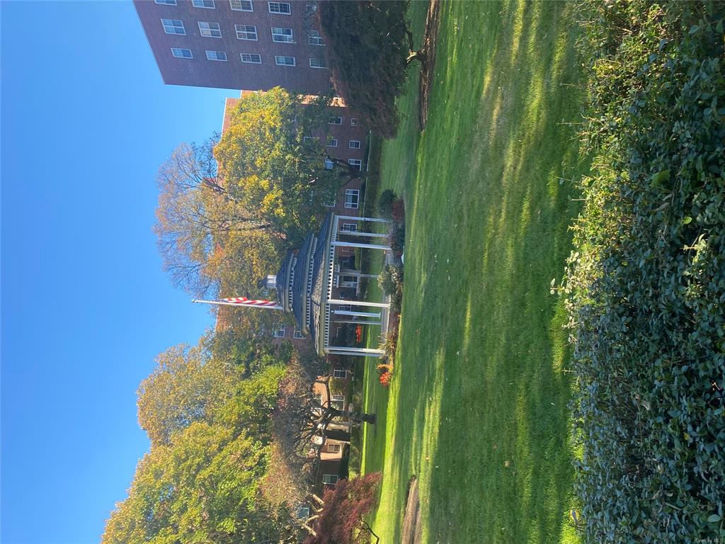 View of homes community featuring a gazebo and a yard