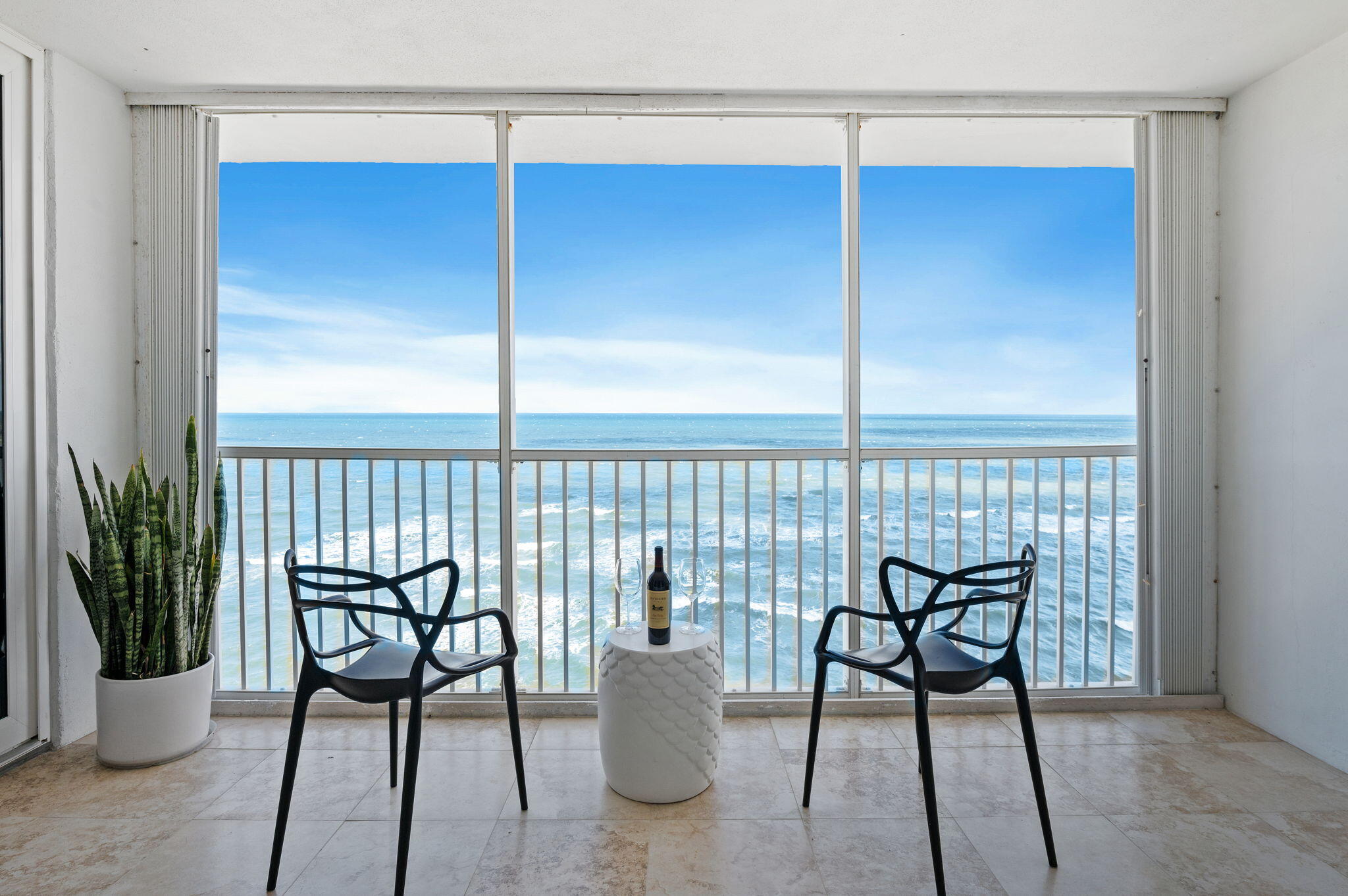 a view of a chair and table in the room