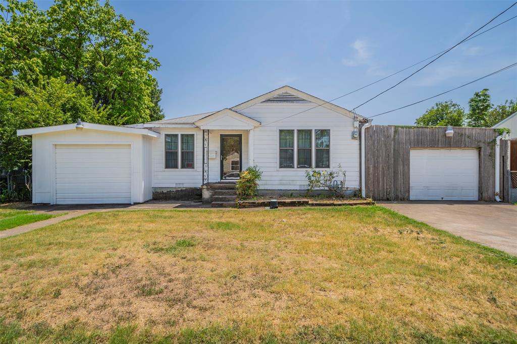 a front view of a house with yard