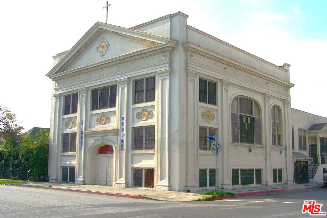 a view of a white building among the street