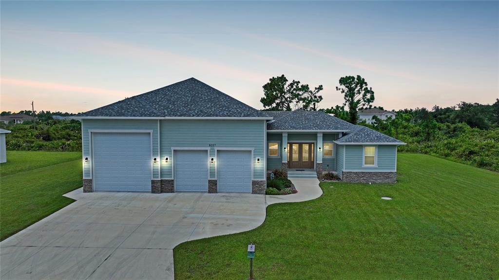 a front view of a house with garden