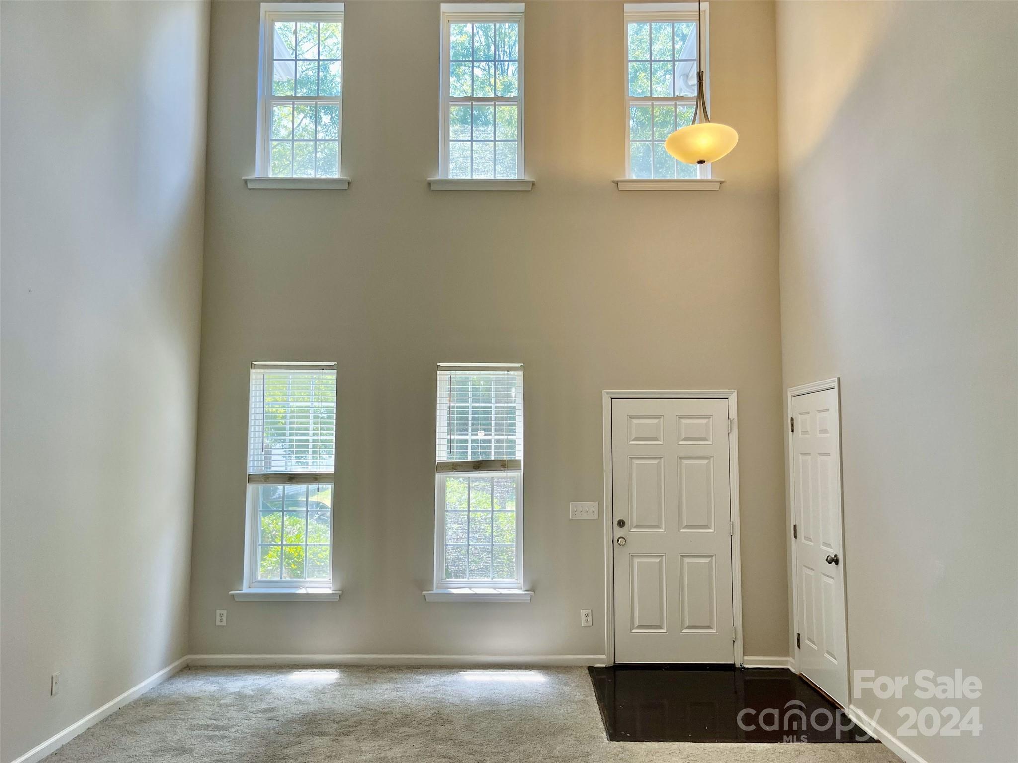 a view of an empty room and window