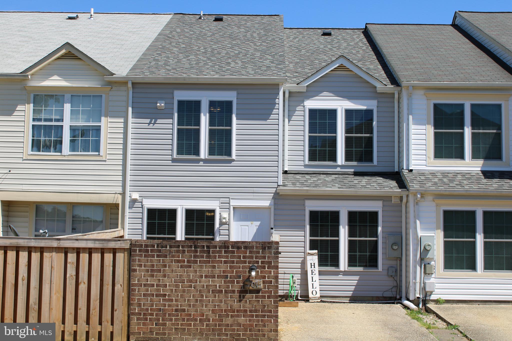 a front view of a house with glass windows