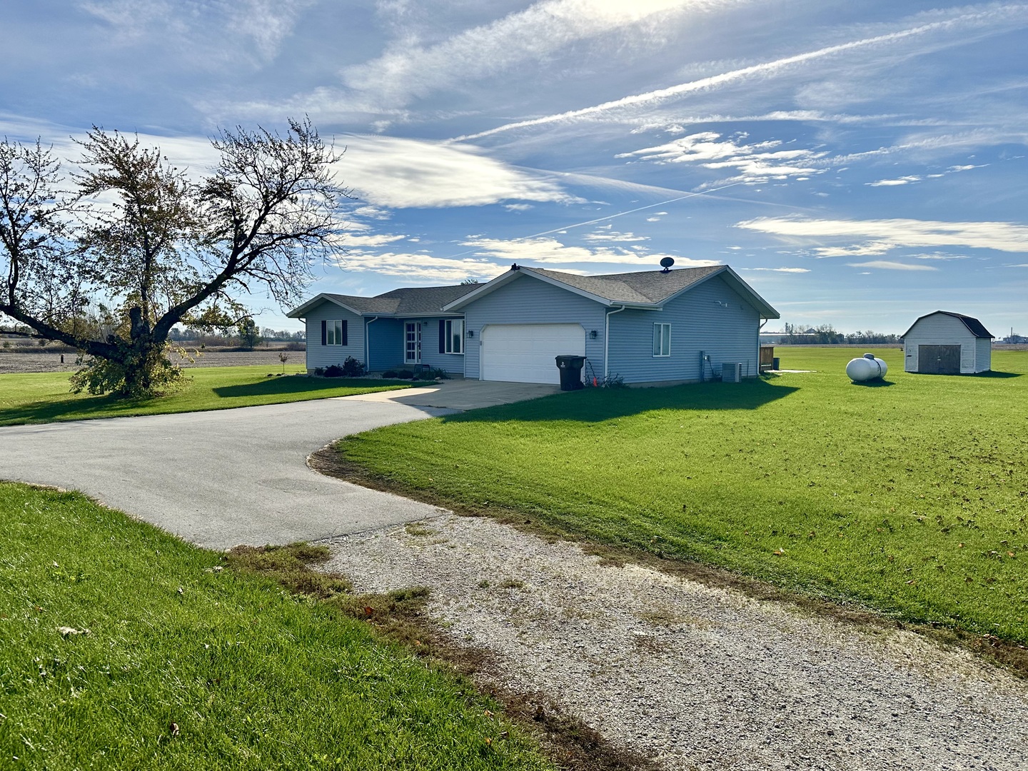 a view of a big yard with a house