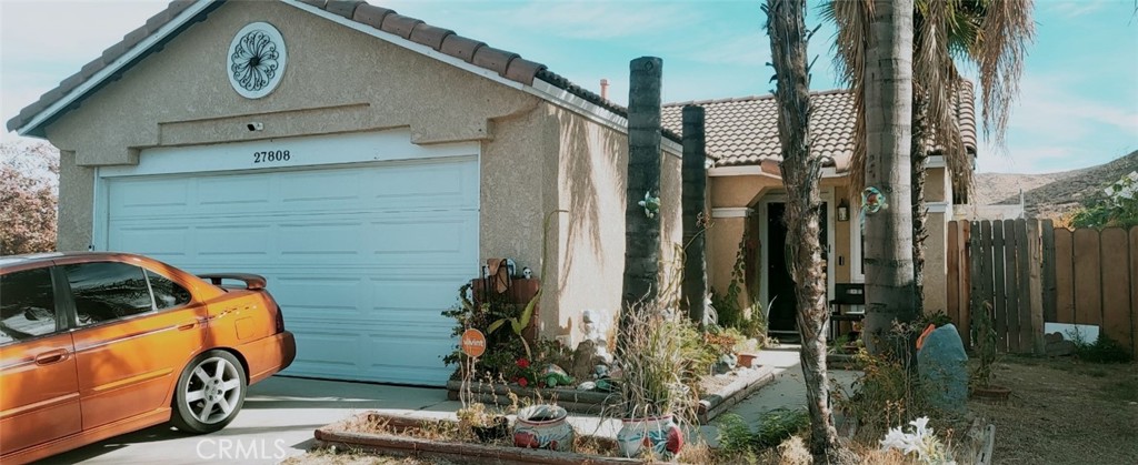 a view of a door and a car parked in garage