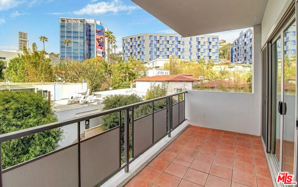 a view of balcony with furniture