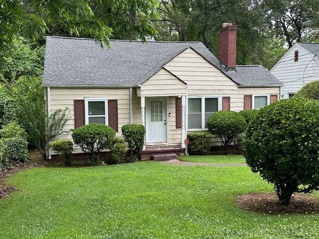 a view of a house with garden and plants