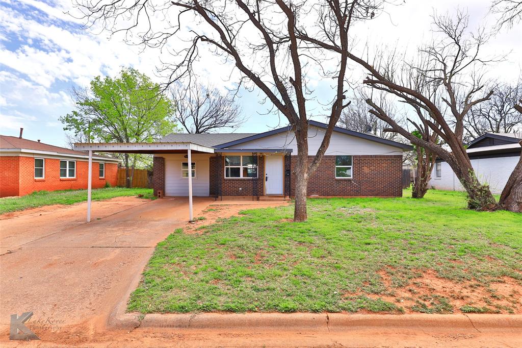 front view of a house with a yard