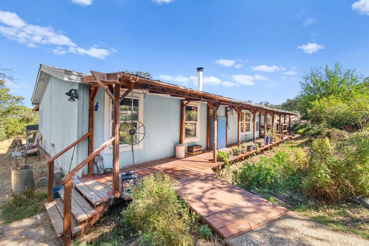 a view of a house with wooden fence