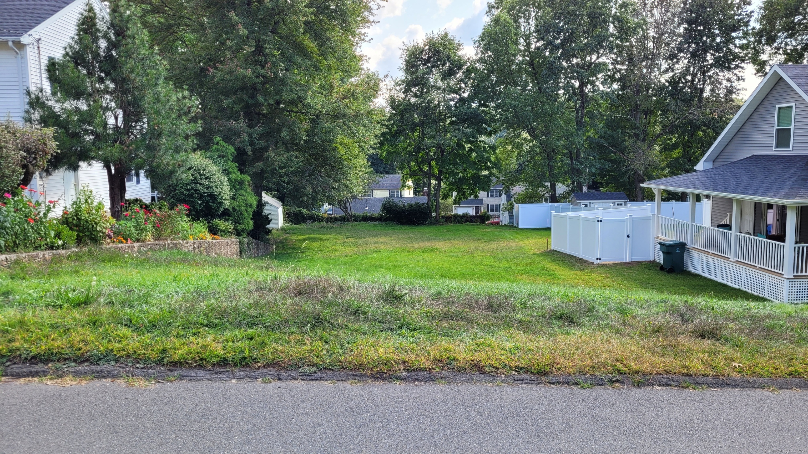 a backyard of a house with lots of green space