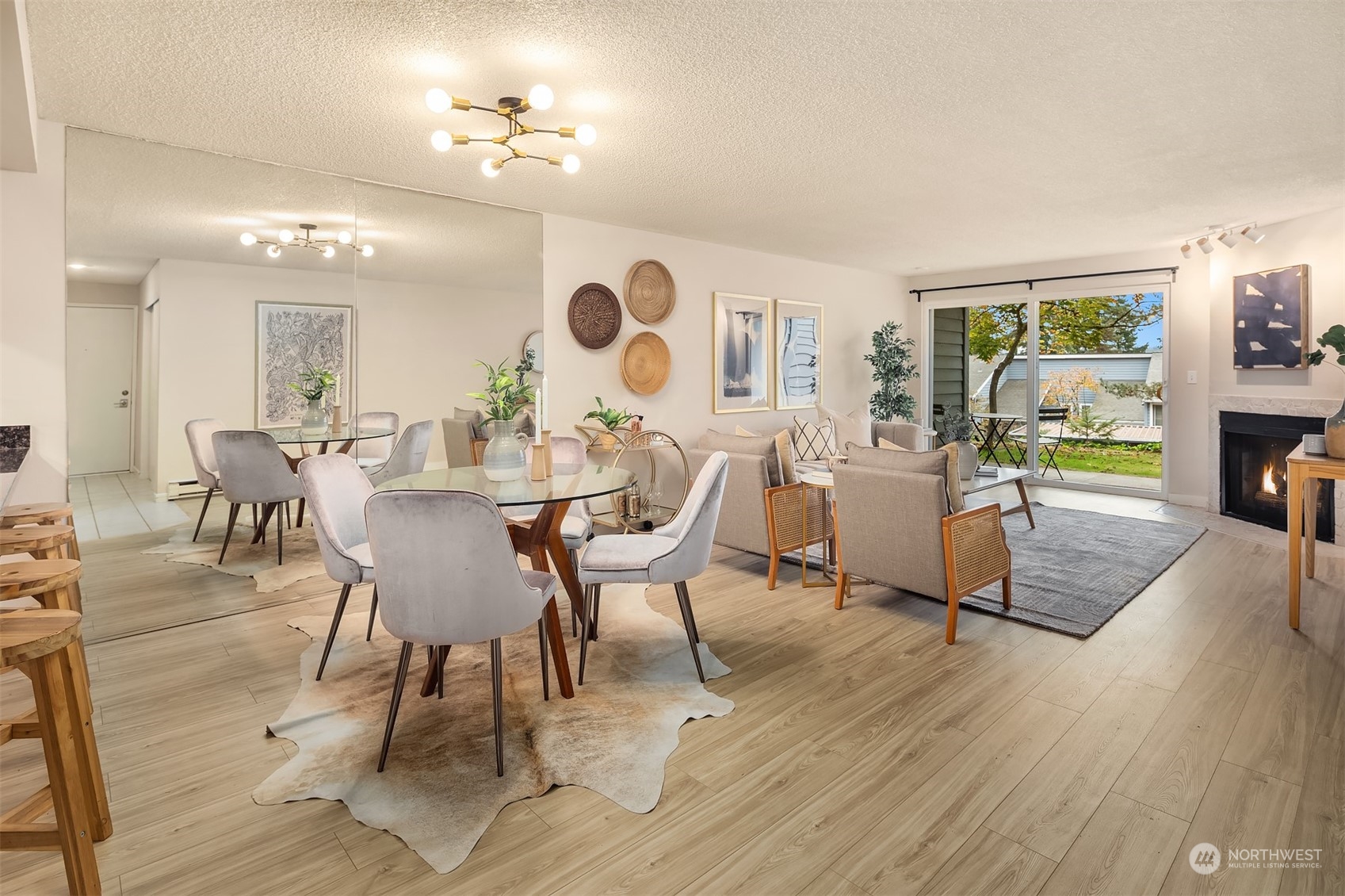 a view of a dining room with furniture window and wooden floor