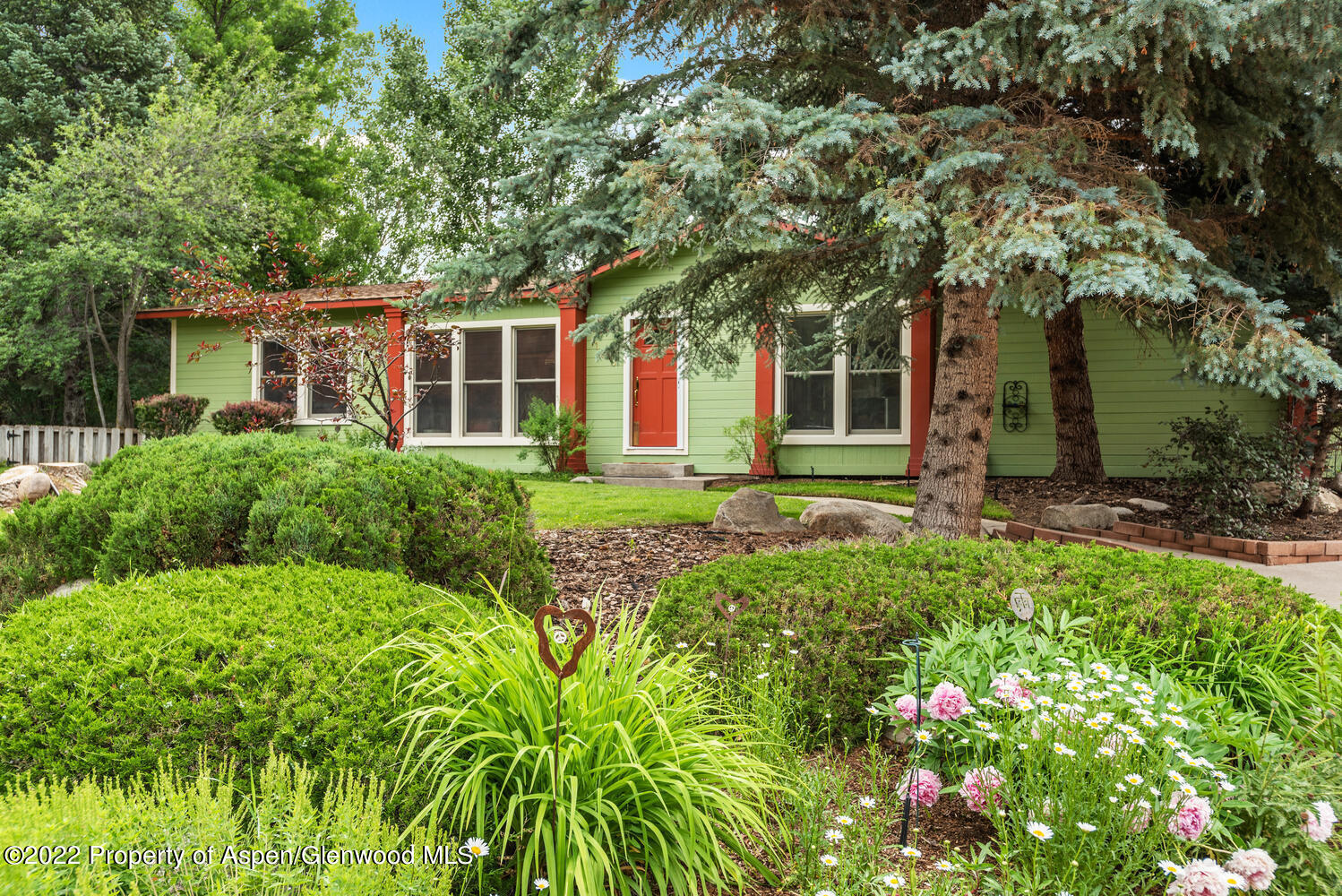 front view of a house with a yard