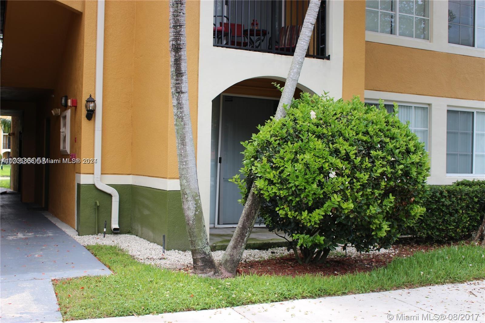 a view of front door and small yard