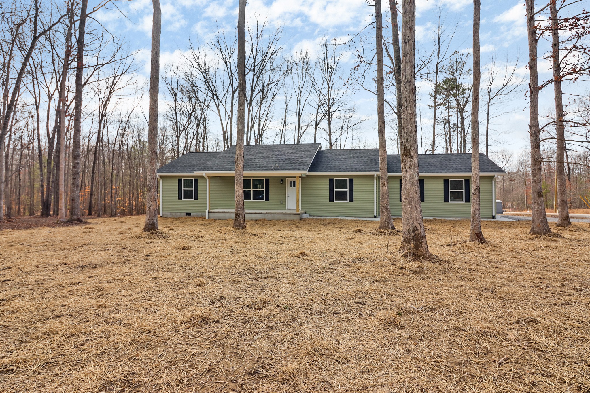 front view of a house with a dry yard