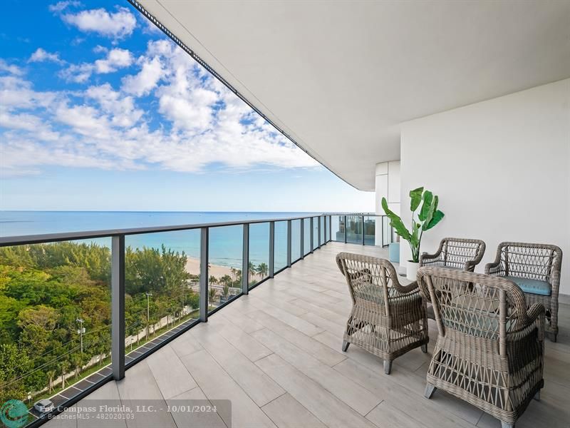 a view of balcony with furniture