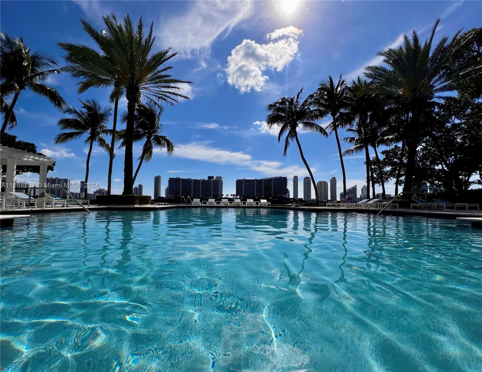 a view of a swimming pool and a yard