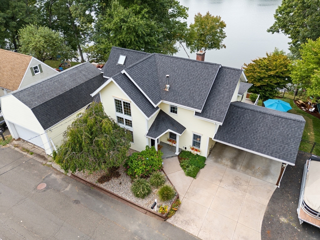 an aerial view of house with yard