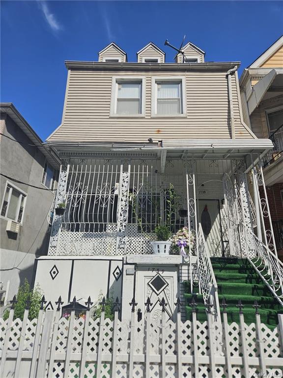 a front view of a house with a porch