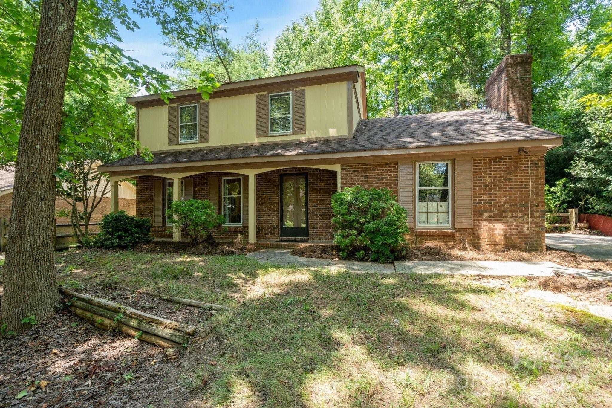 front view of a house with a yard