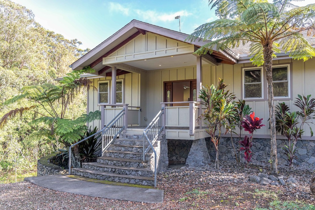 a front view of a house with garden