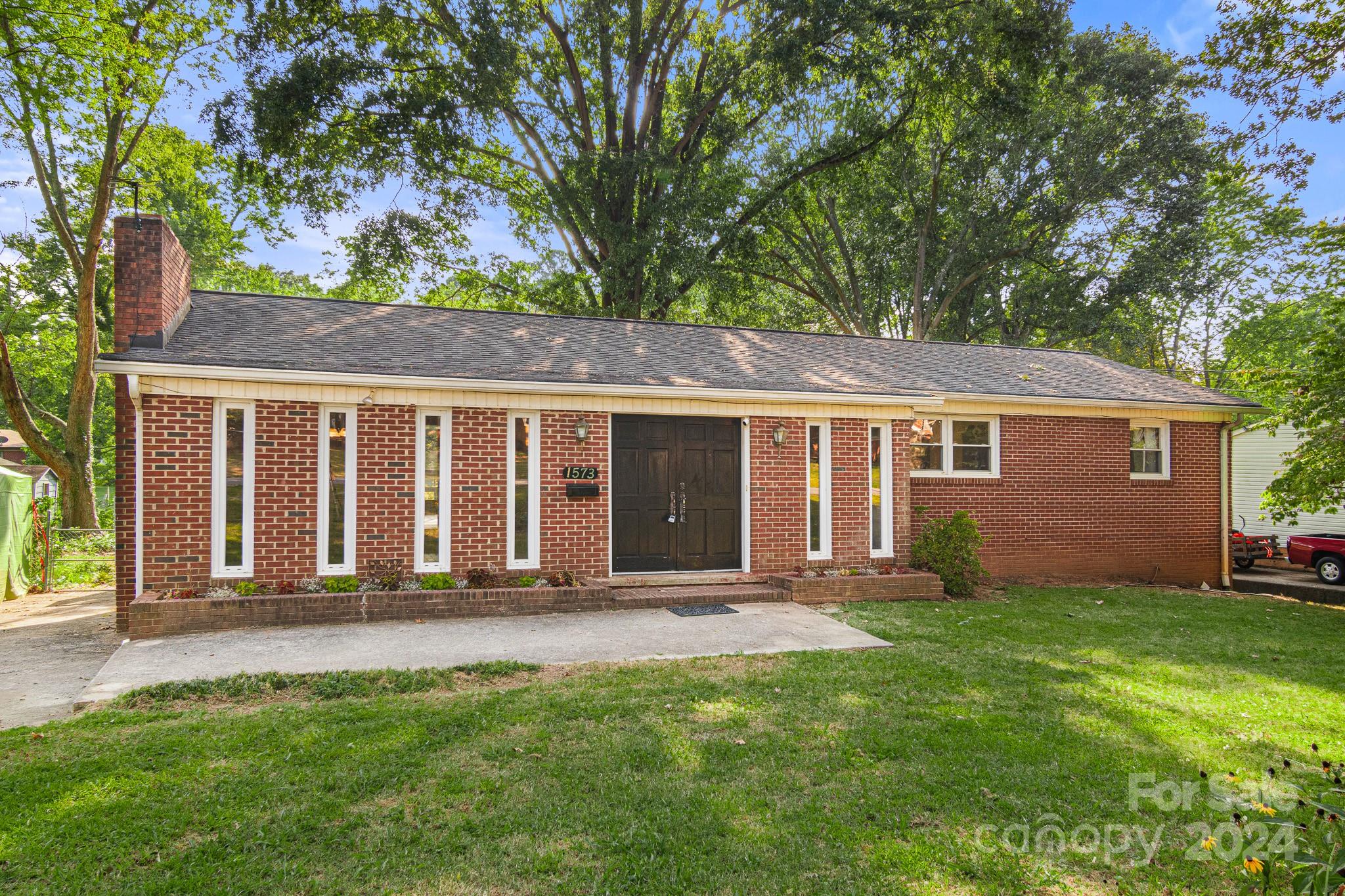 front view of a house with a yard