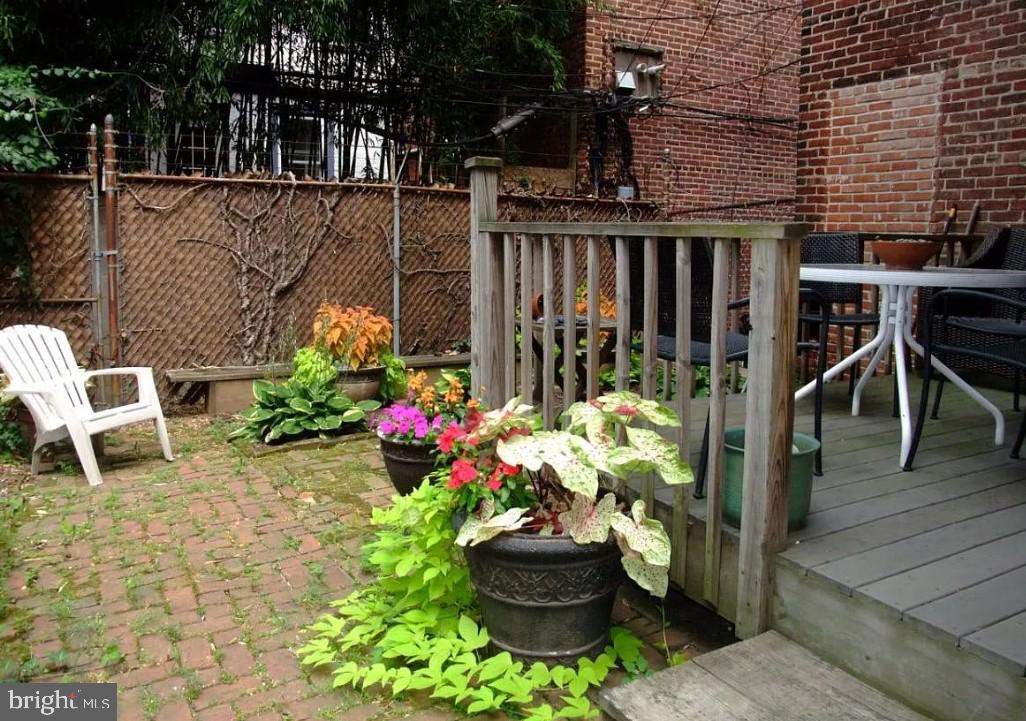 a view of a chairs and table in a patio