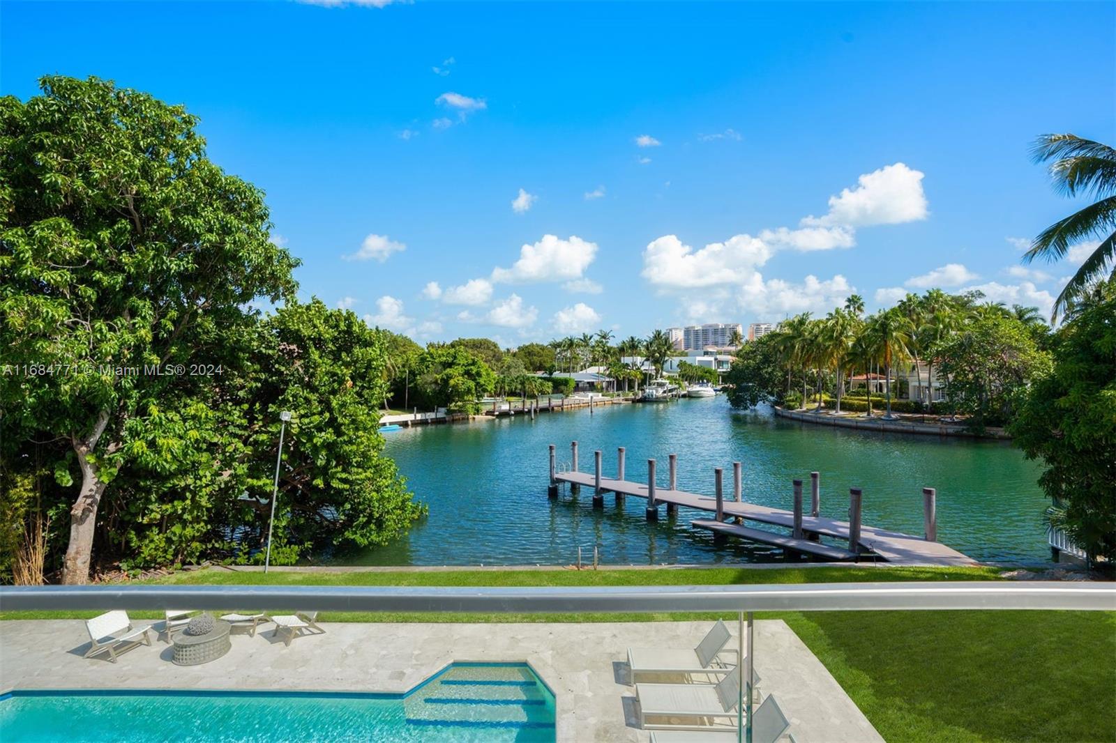 a view of a lake with houses in the background