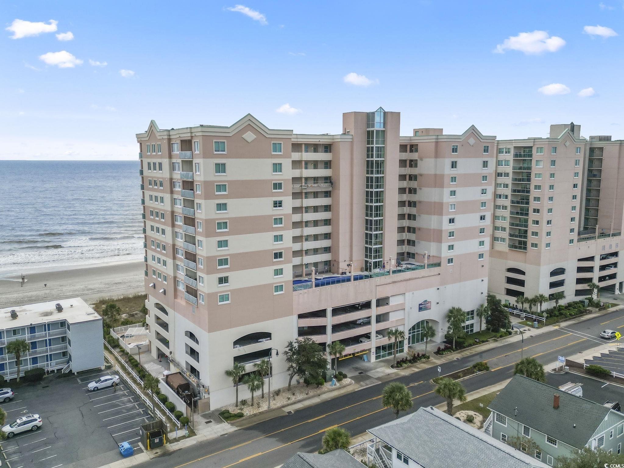 View of building exterior featuring a water view a