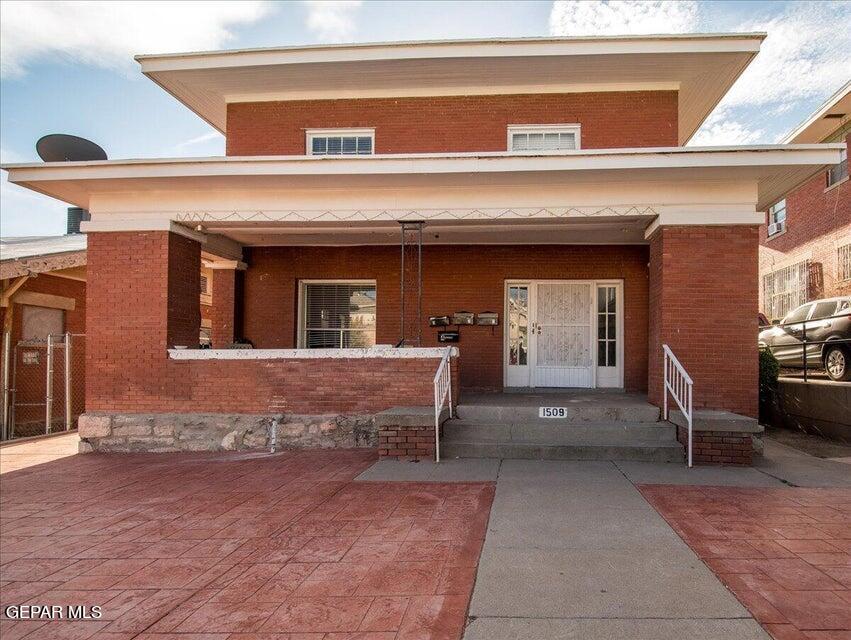 a view of a building with sitting area