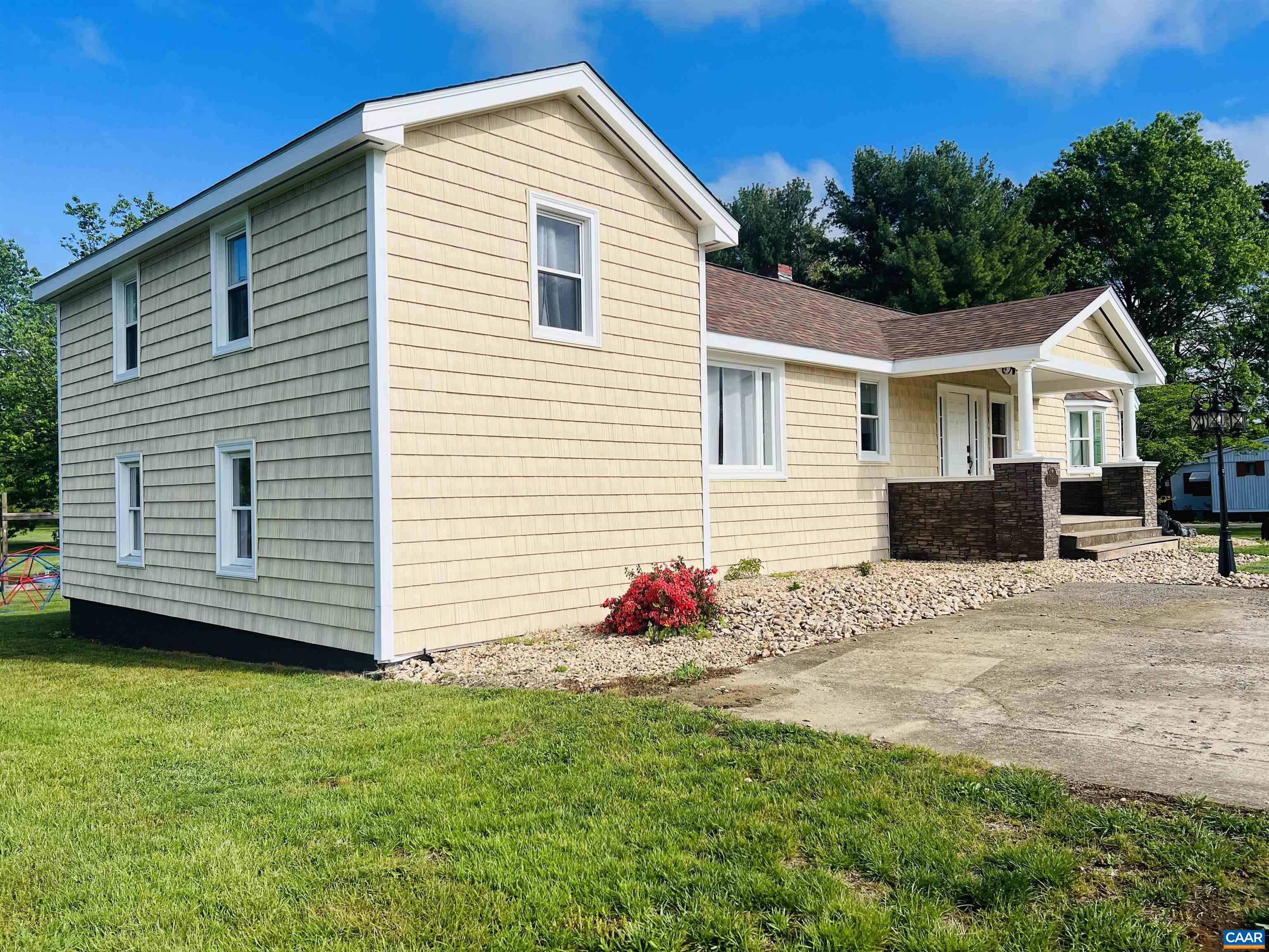 a front view of a house with a yard