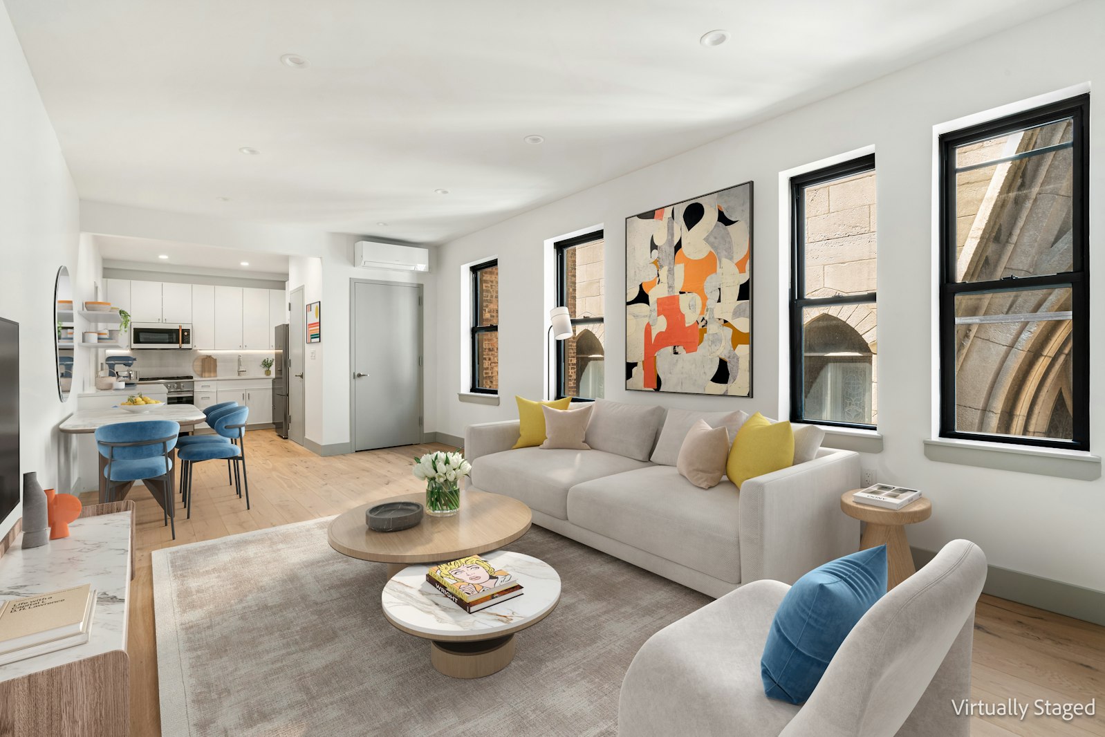 a living room with furniture and wooden floor