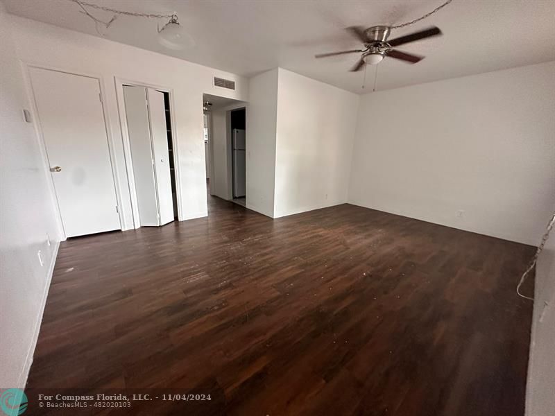 a view of an empty room with a window