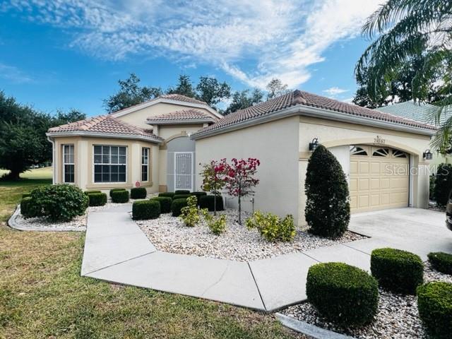 a front view of a house with a yard