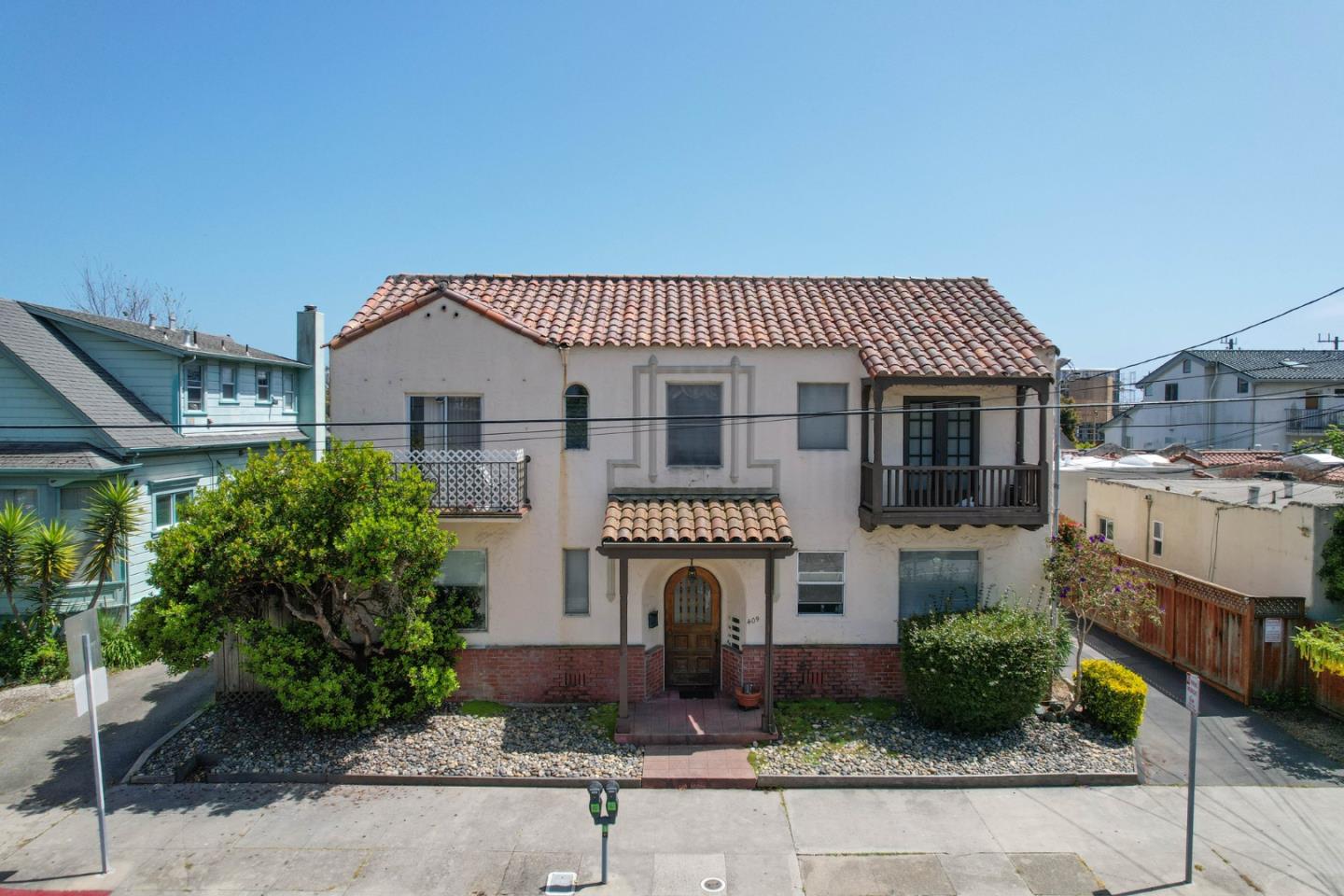 a front view of a house with a garden