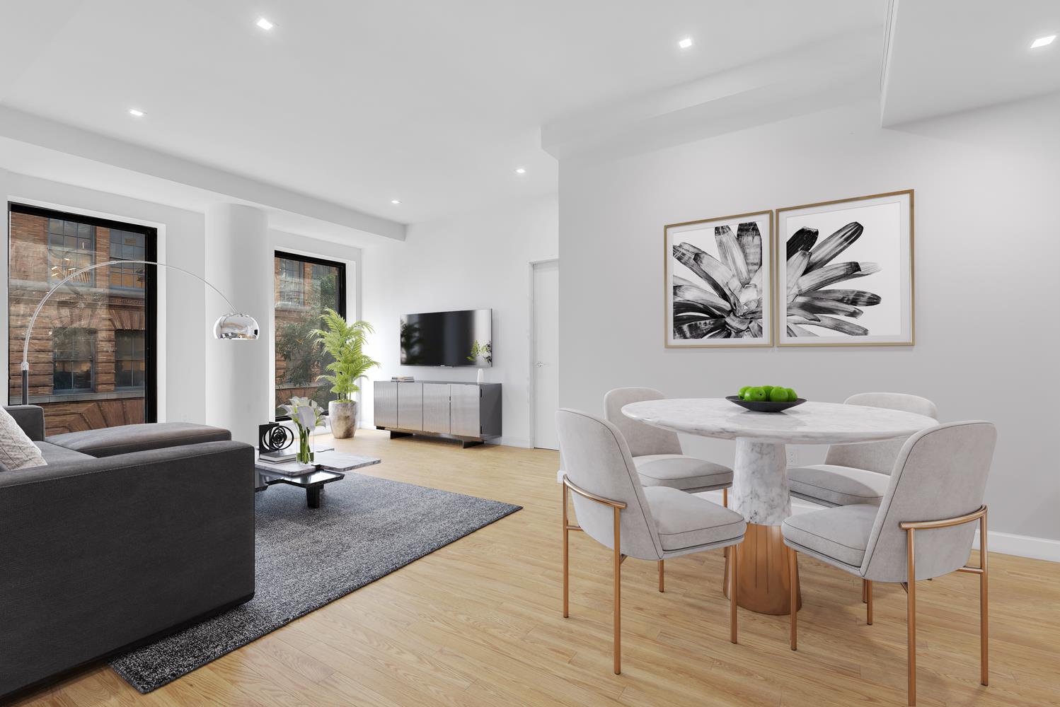 a living room with furniture a flat screen tv and a table