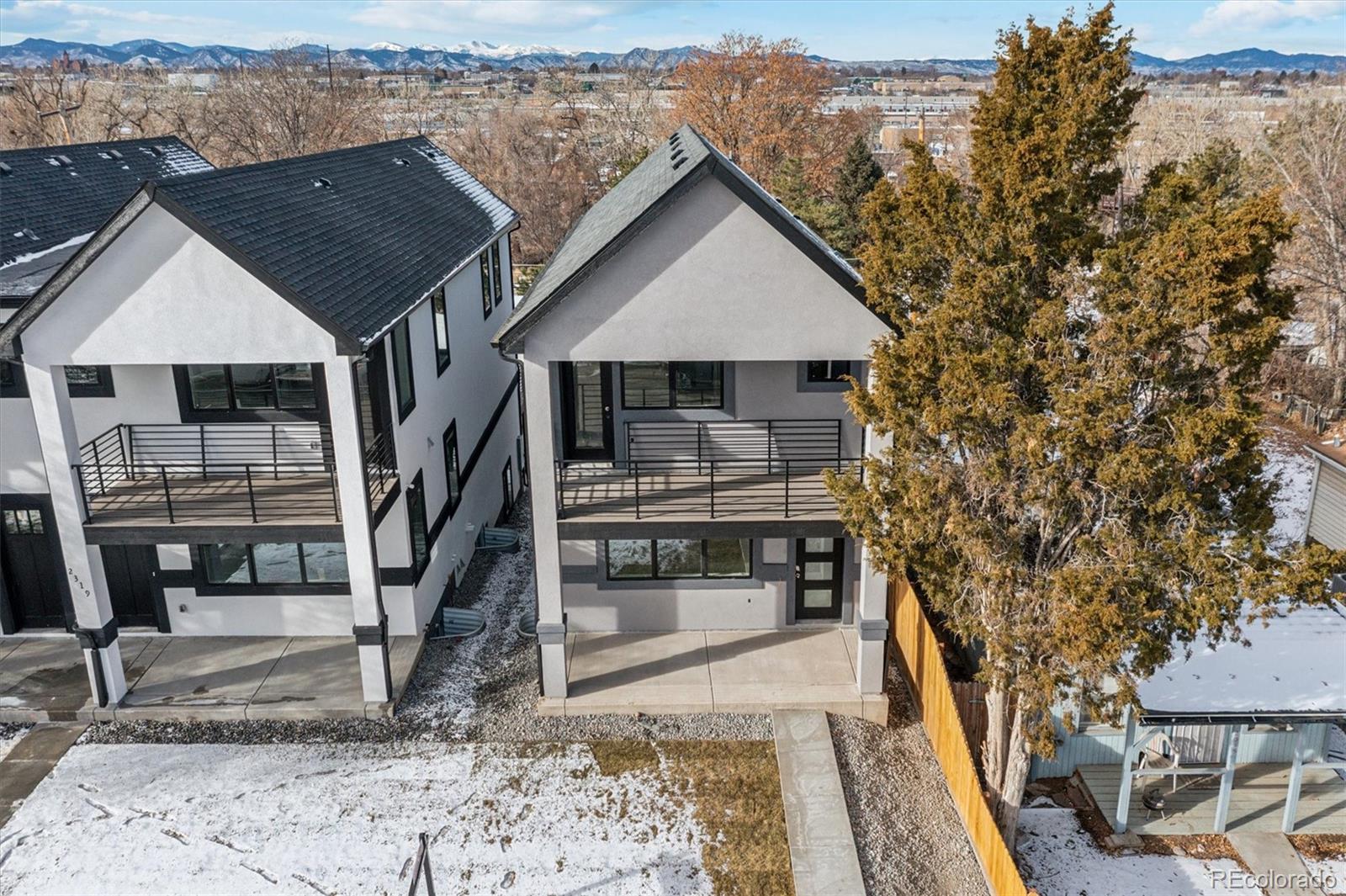 a view of house with roof deck and seating space