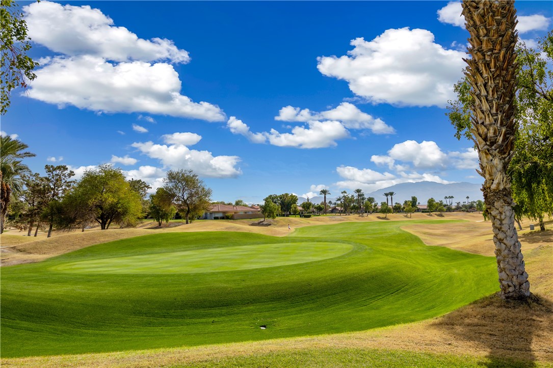 a view of a golf course with a swimming pool