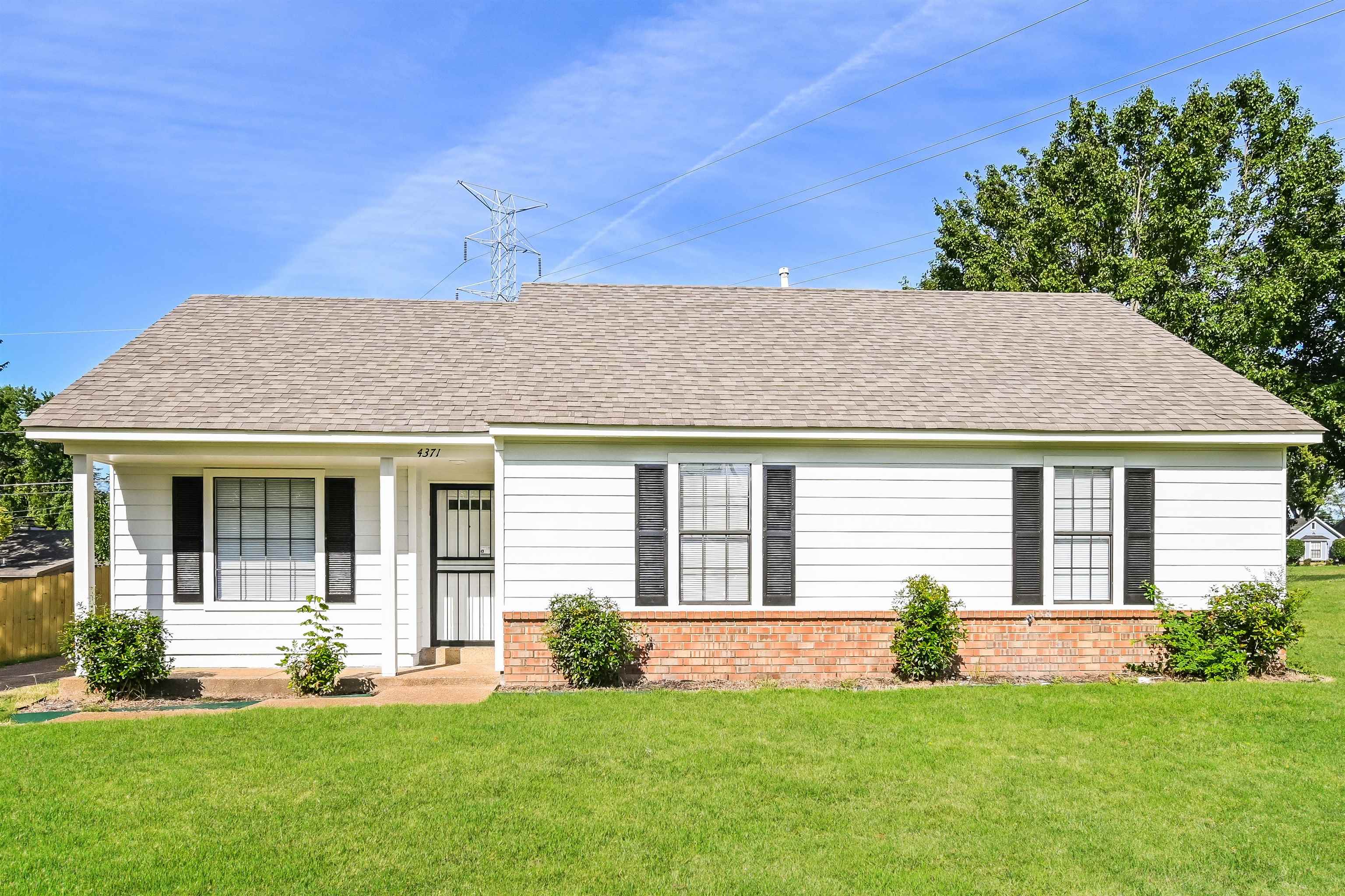 front view of a house and a yard