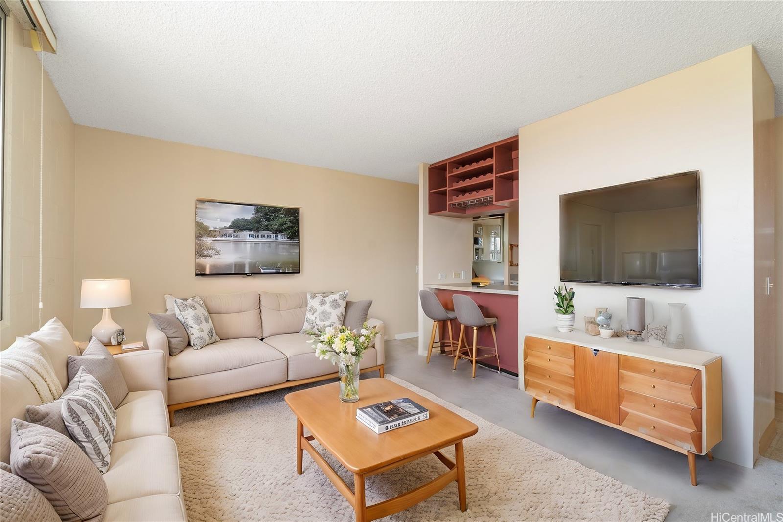 a living room with furniture and a flat screen tv