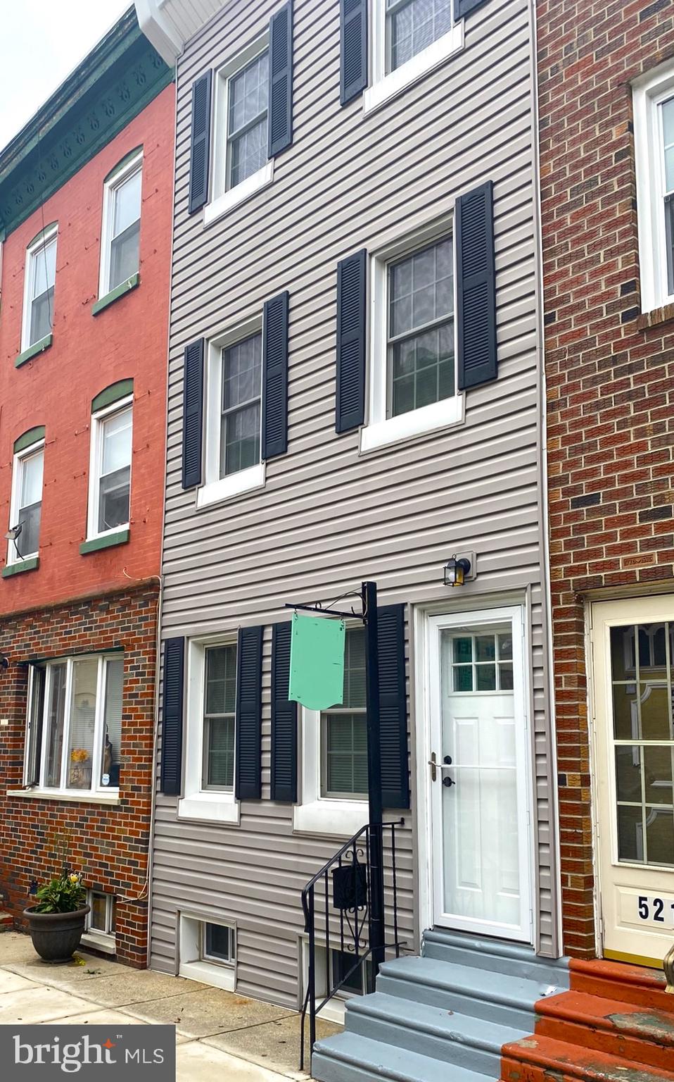 a view of a house with a window and balcony