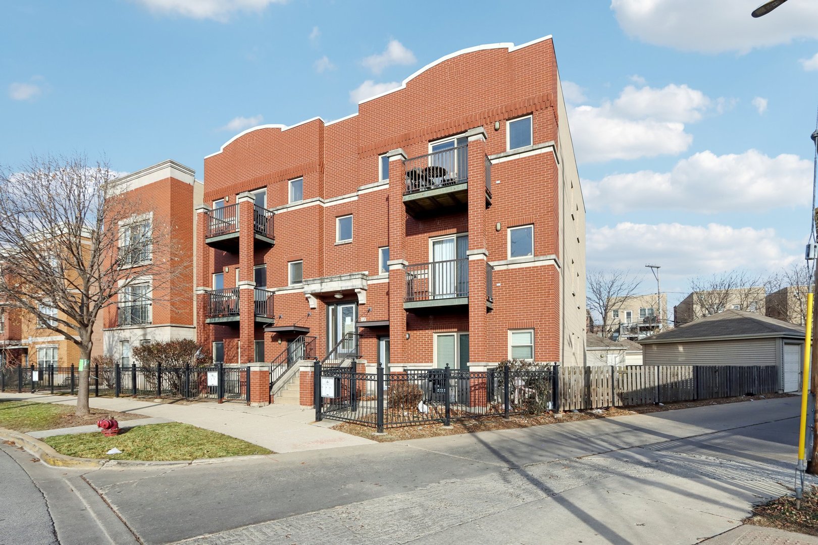 a front view of a building with street view