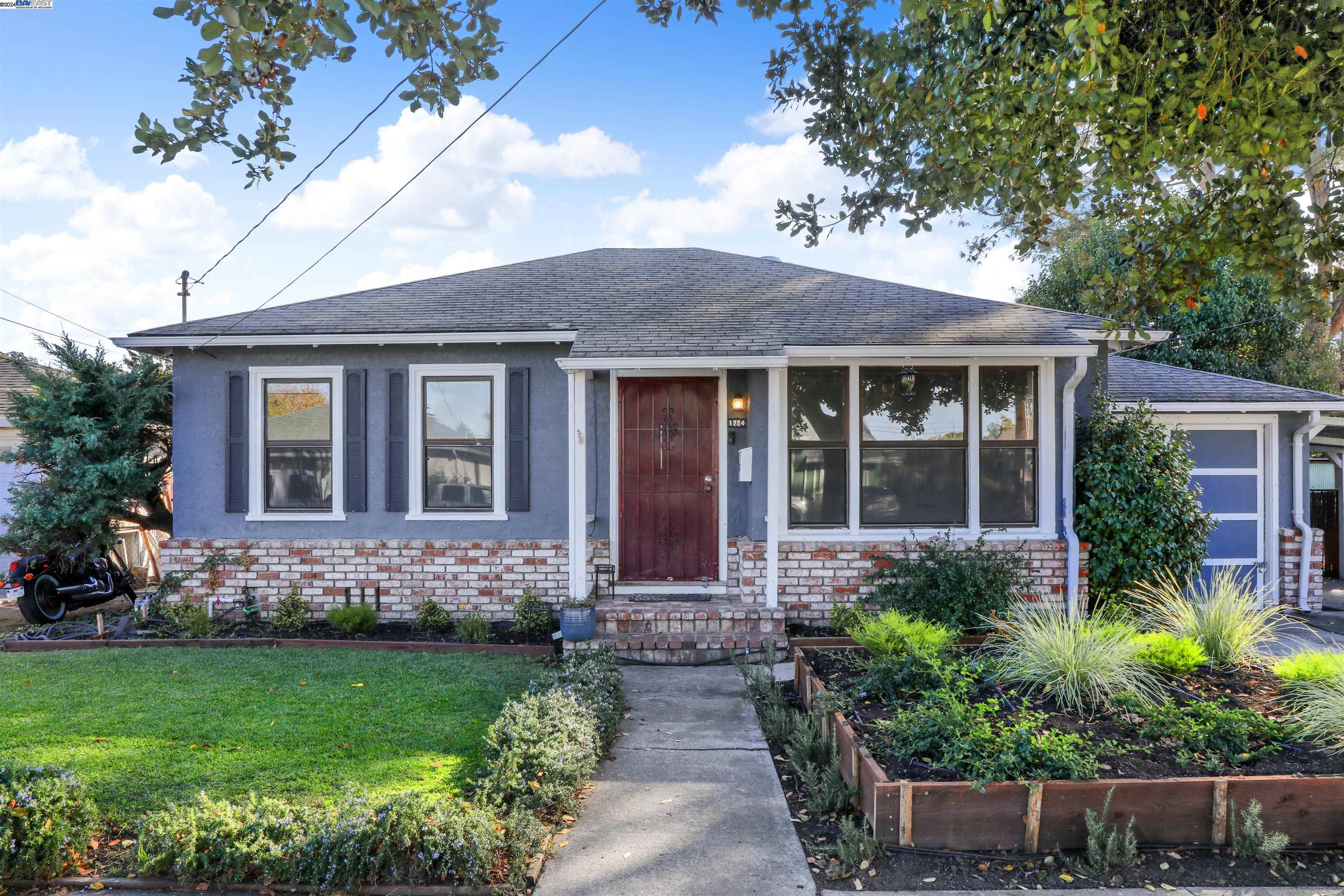 front view of a house with potted plants